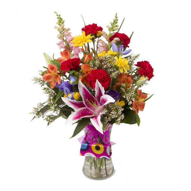 Geschenkideen Blumen Wien – Kreative Deko- & Blumengeschenke: bunte Blumenarrangements in Glasvase für besondere Anlässe.