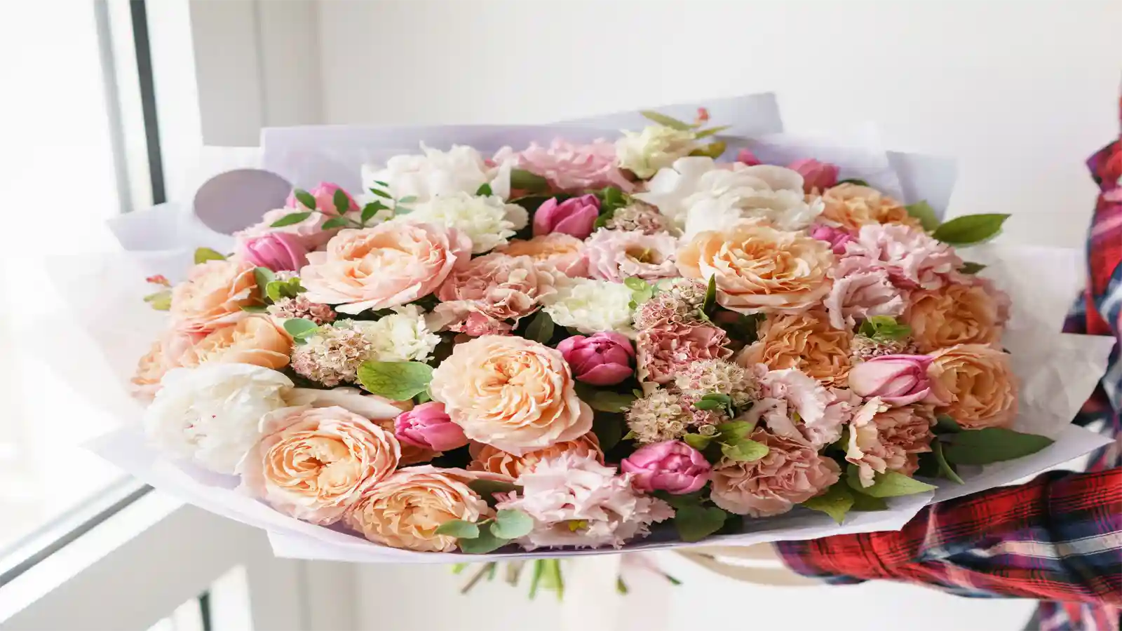 Bouquet of flowers in a box with a white background
