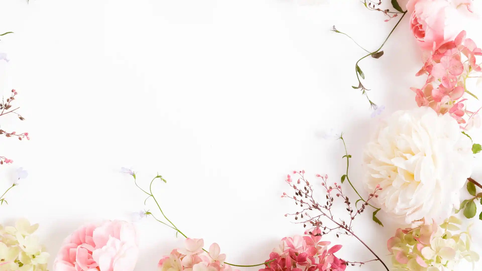 Floral arrangement with pink and white flowers on a light background